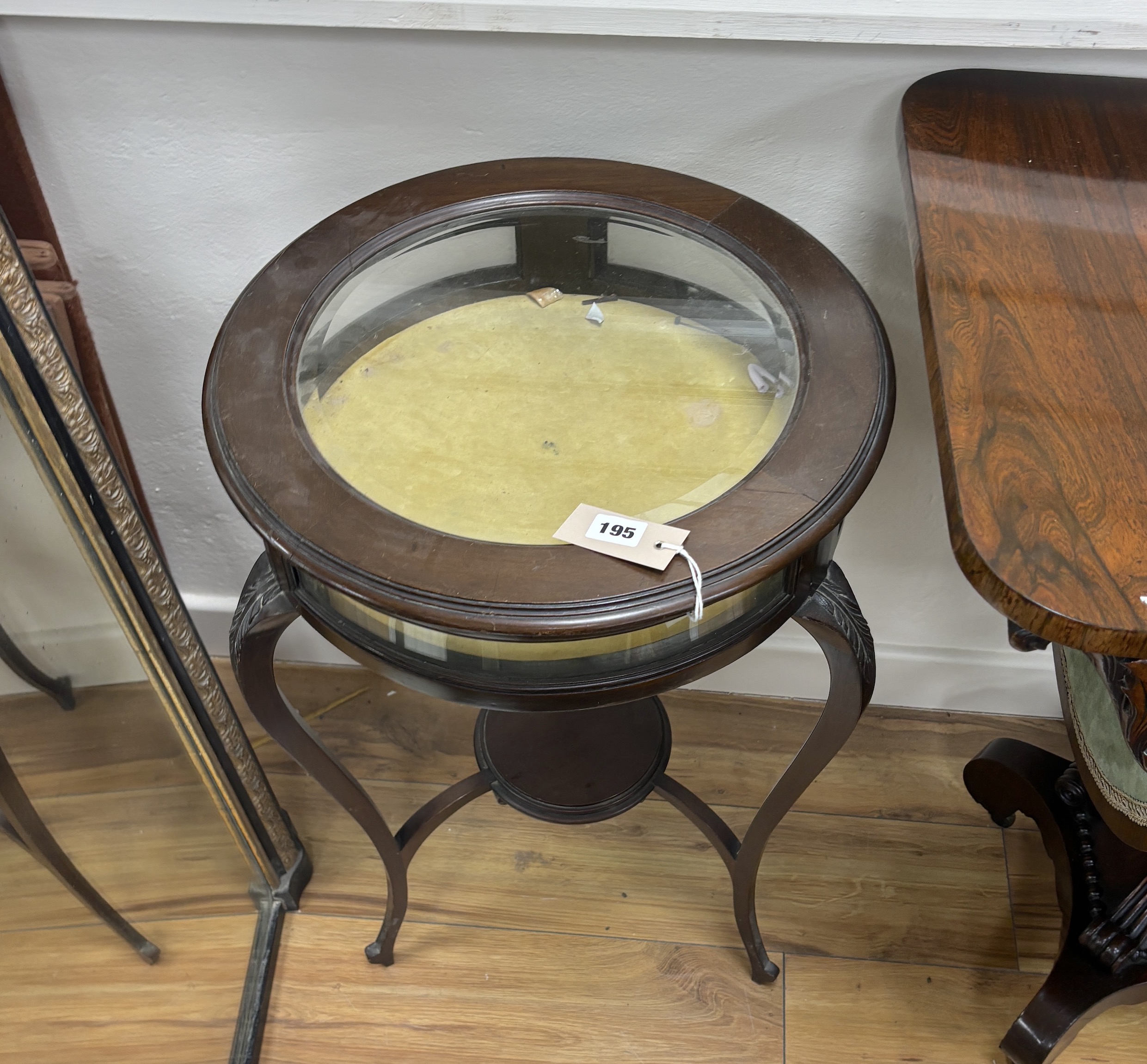 An Edwardian circular mahogany bijouterie table, diameter 43cm, height 72cm